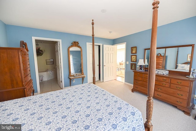 carpeted bedroom with ensuite bath