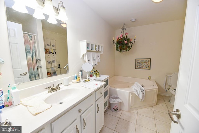 bathroom featuring tile patterned flooring, vanity, a bathtub, and toilet