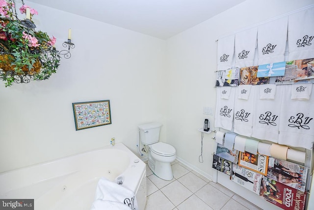 bathroom with tile patterned floors, a tub to relax in, and toilet