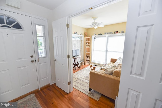 entryway with hardwood / wood-style flooring and ceiling fan