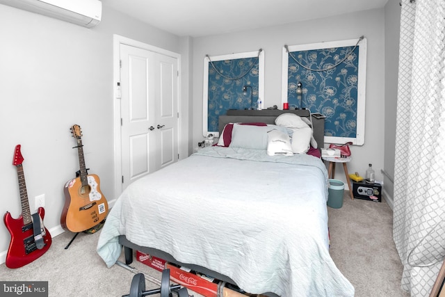 bedroom featuring carpet floors, an AC wall unit, and a closet