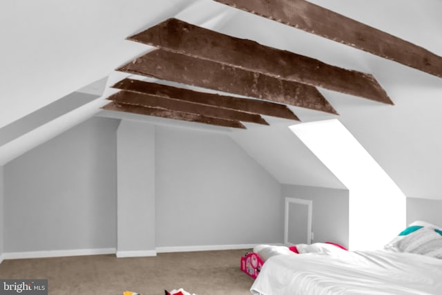 bedroom featuring carpet and vaulted ceiling with beams