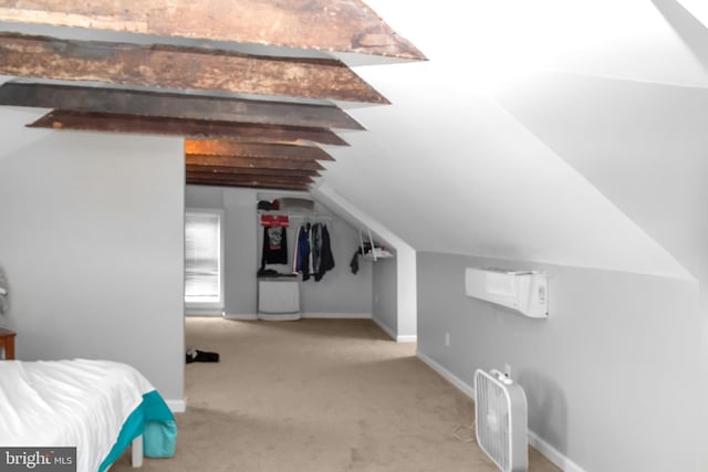 bedroom featuring vaulted ceiling with beams and light colored carpet