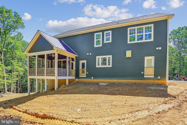 rear view of house with a sunroom