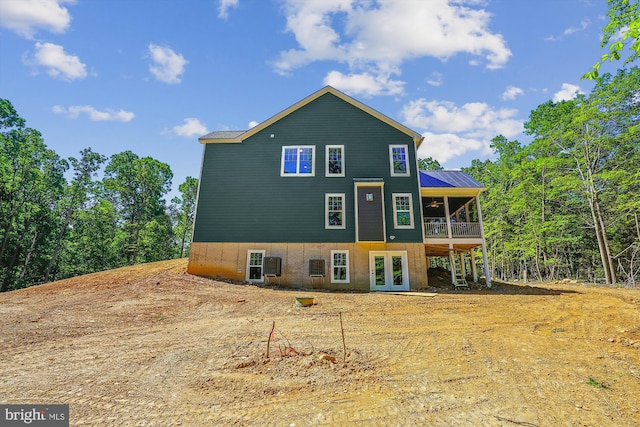 back of house featuring french doors