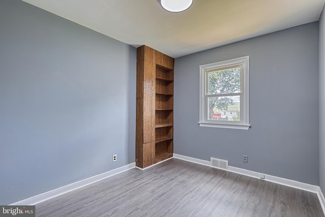 empty room with light wood-type flooring