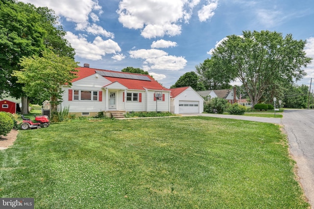 view of front of house featuring a front lawn and solar panels