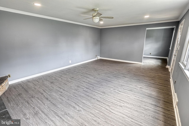 spare room featuring ceiling fan, dark hardwood / wood-style flooring, and crown molding