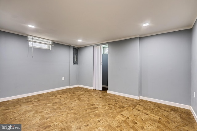 basement with electric panel and a wealth of natural light