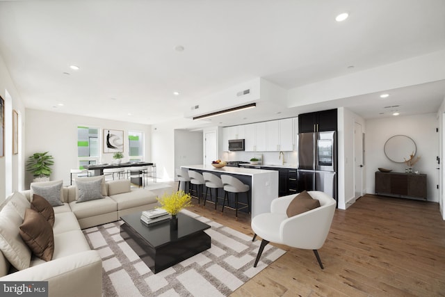 living room with light hardwood / wood-style flooring