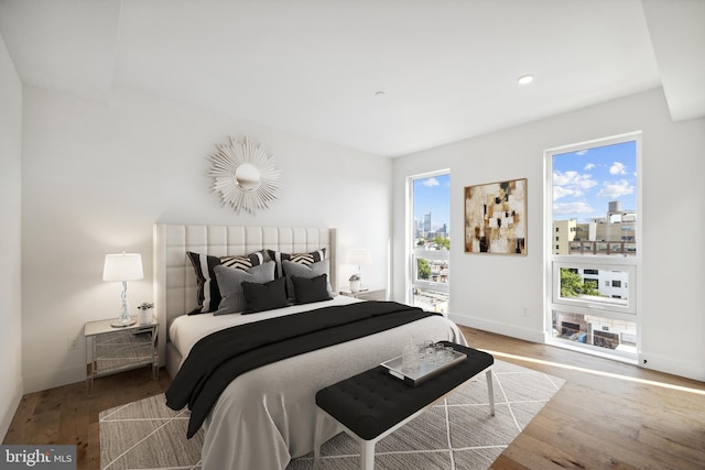 bedroom with hardwood / wood-style flooring