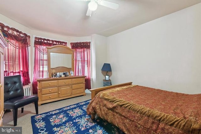 bedroom featuring ceiling fan and carpet floors