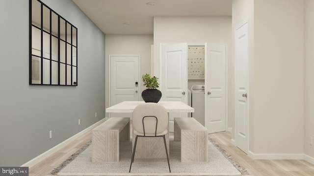 office with washer / dryer and light wood-type flooring