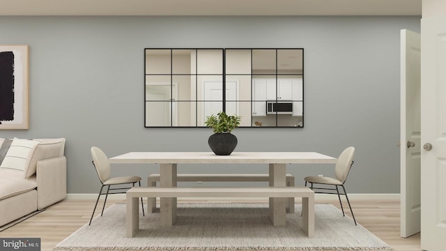 dining area with light hardwood / wood-style floors