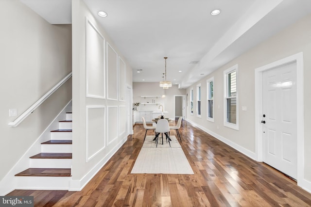 unfurnished dining area with dark hardwood / wood-style flooring