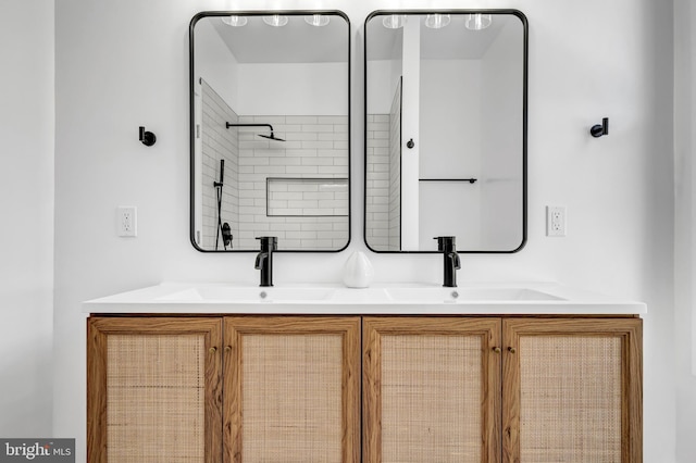 bathroom with vanity and walk in shower