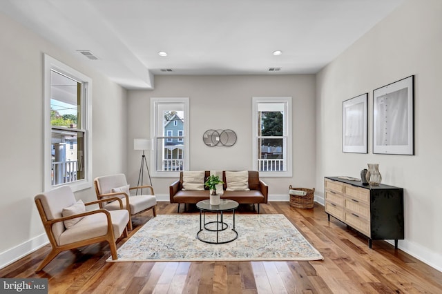 living area with light hardwood / wood-style floors