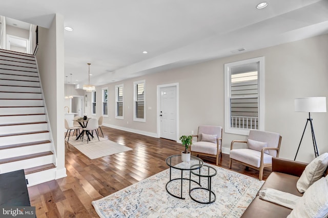 living room with dark hardwood / wood-style flooring