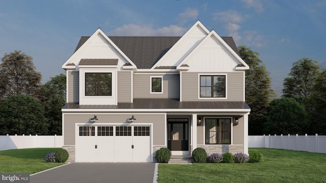 view of front of home with a front yard and a garage