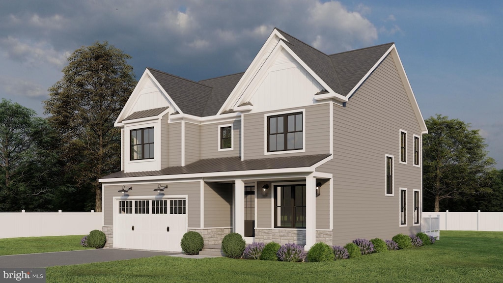 view of front of house featuring a porch, a front yard, and a garage