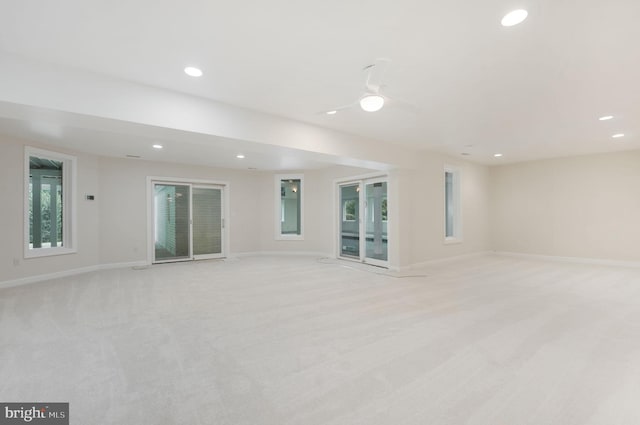 carpeted empty room featuring ceiling fan