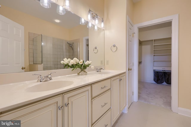 bathroom with a shower with door and vanity