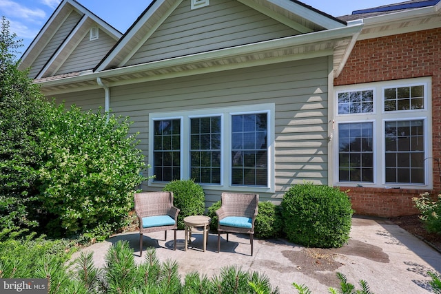 back of property featuring a patio