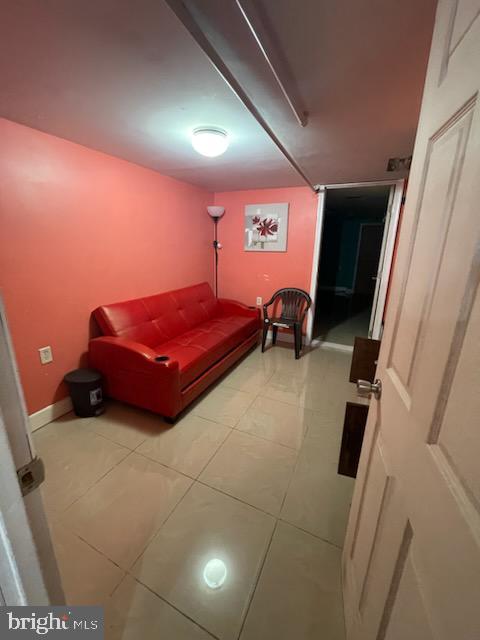 bedroom with light tile patterned floors