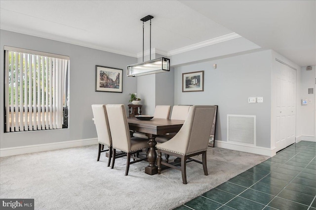 tiled dining area with crown molding