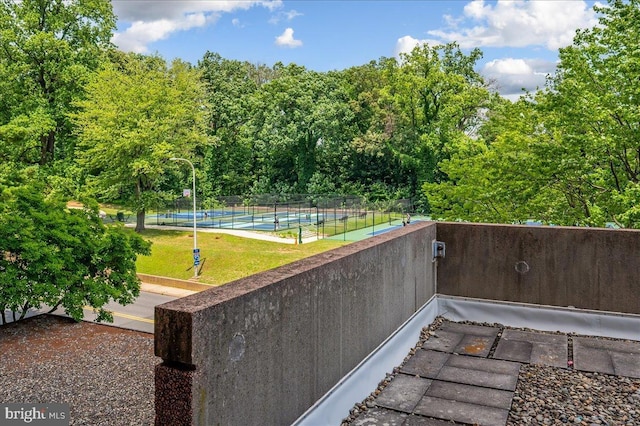 exterior space with tennis court