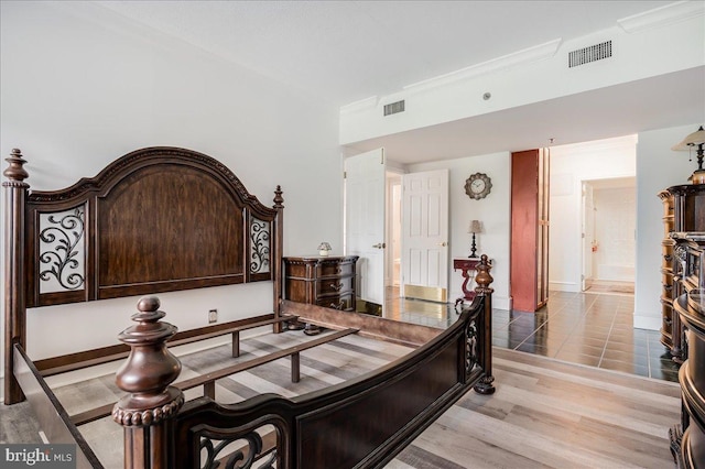 bedroom with light tile patterned floors