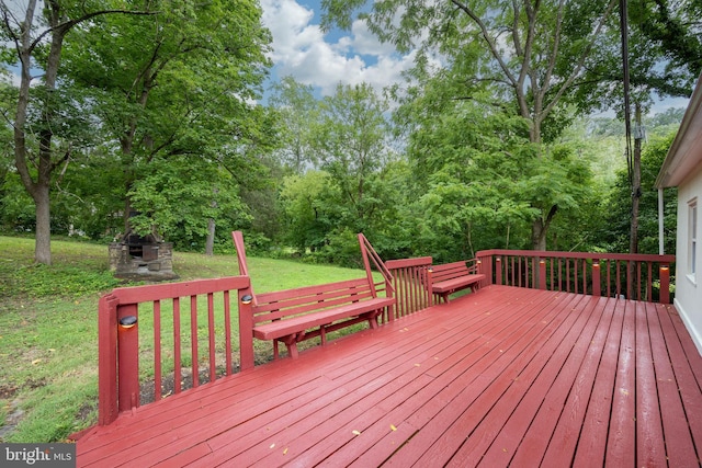 wooden terrace with a yard