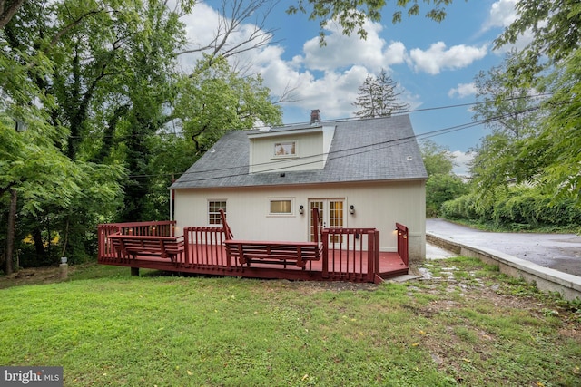 back of house with a yard and a deck