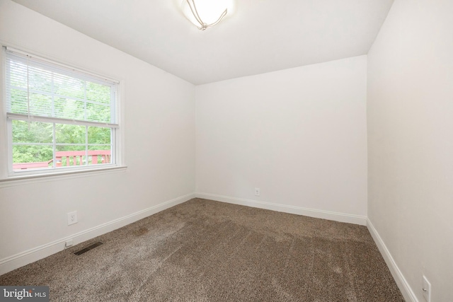 empty room featuring carpet floors