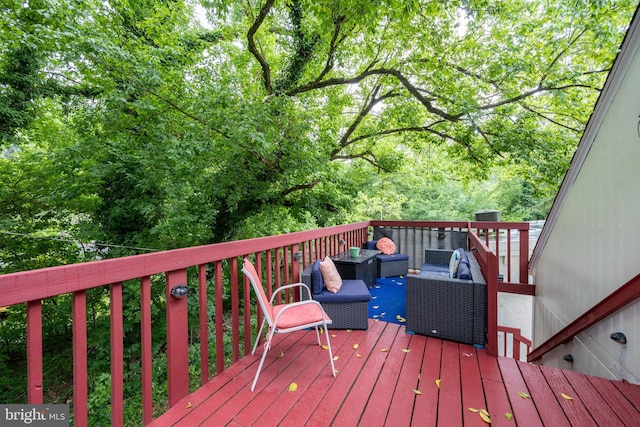 wooden terrace with outdoor lounge area