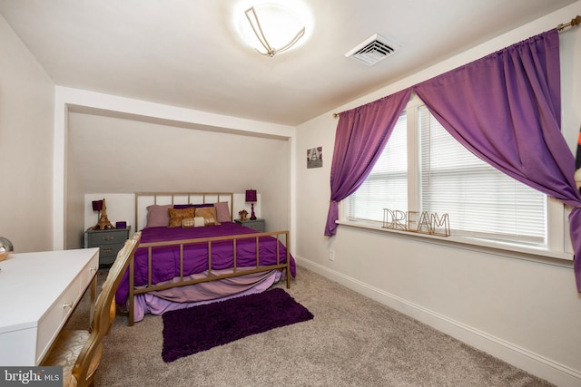 bedroom with light colored carpet