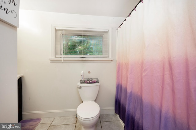 bathroom featuring tile patterned flooring and toilet