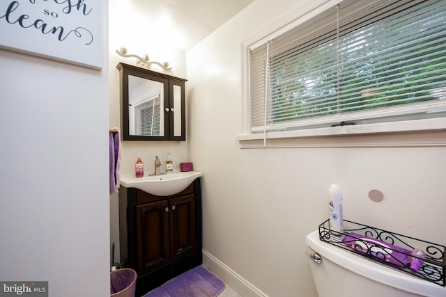 bathroom with vanity and toilet