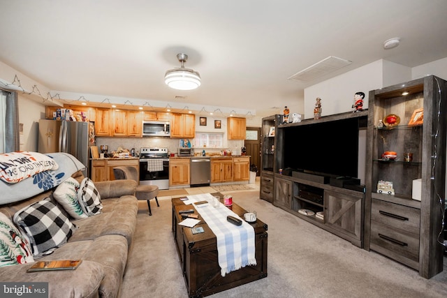 living room with light colored carpet