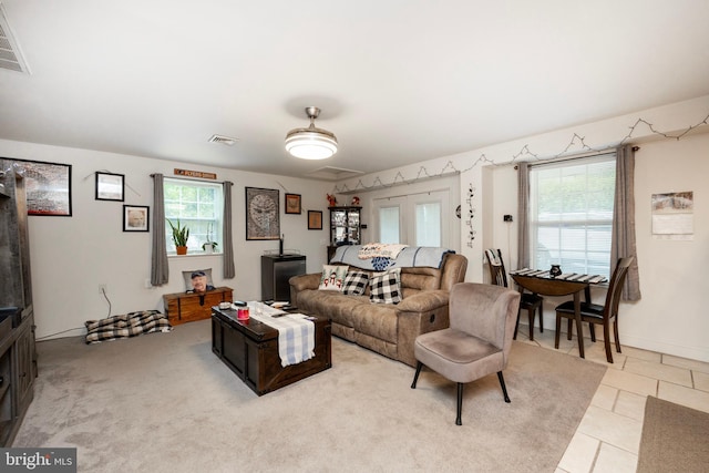 living room featuring light tile patterned floors and a wealth of natural light