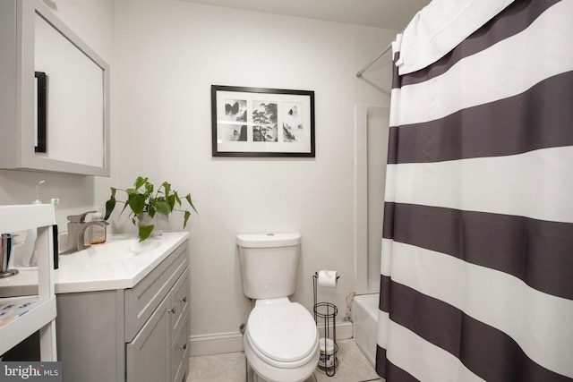 full bathroom with tile patterned flooring, vanity, shower / tub combo with curtain, and toilet