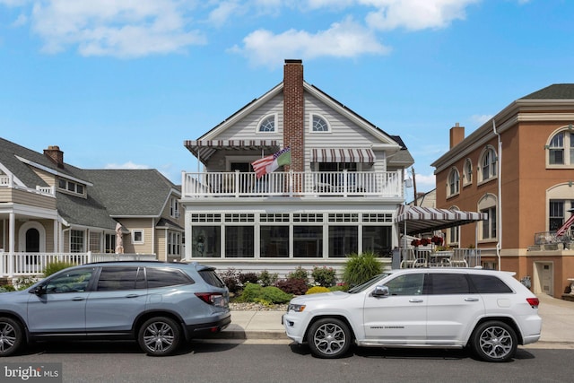 view of front of house with a balcony