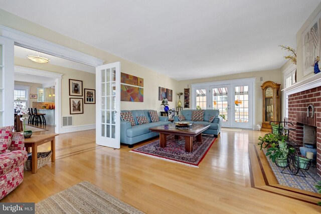 living room featuring a fireplace and hardwood / wood-style flooring