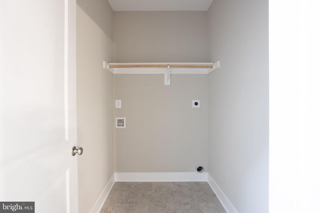 washroom with hookup for an electric dryer and hookup for a washing machine