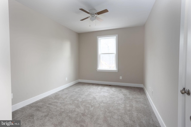 empty room with light carpet and ceiling fan