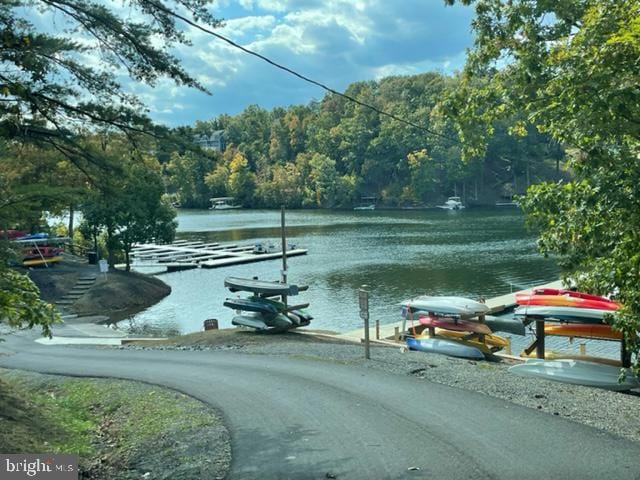 property view of water featuring a boat dock