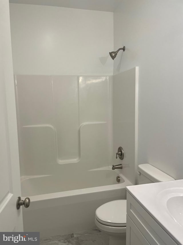 full bathroom featuring shower / bathing tub combination, vanity, and toilet