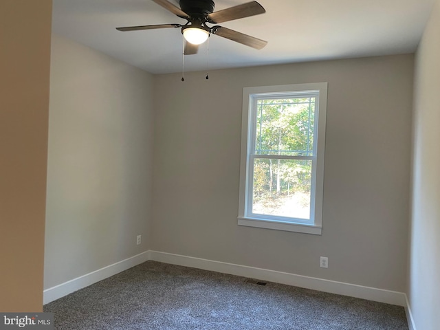 carpeted empty room with ceiling fan