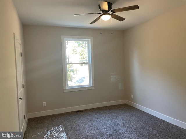 carpeted empty room with ceiling fan