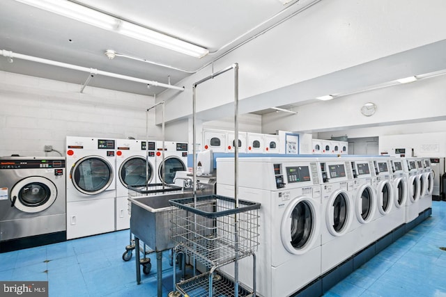 laundry room with washer and dryer and sink